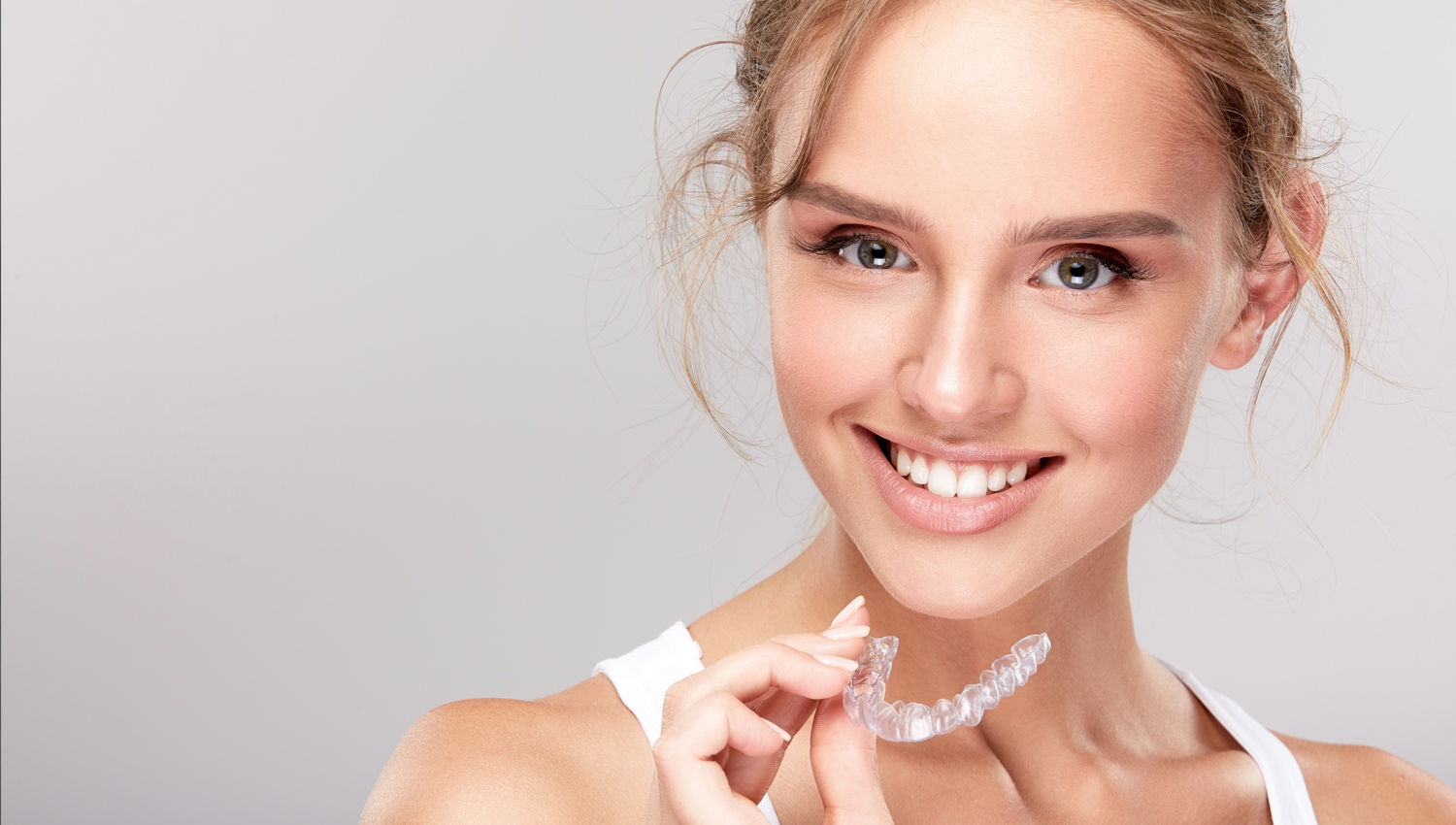 The Mother Of One Undergoing A Teeth Whitening Treatment At Home In Essex