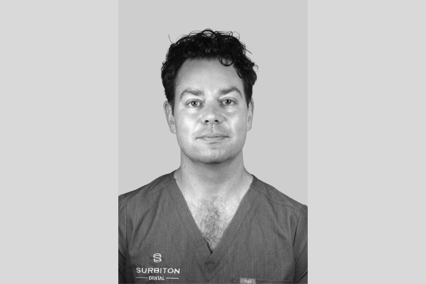 Black and white headshot portrait of Dr Eamon O'Farrell at Surbiton Dental