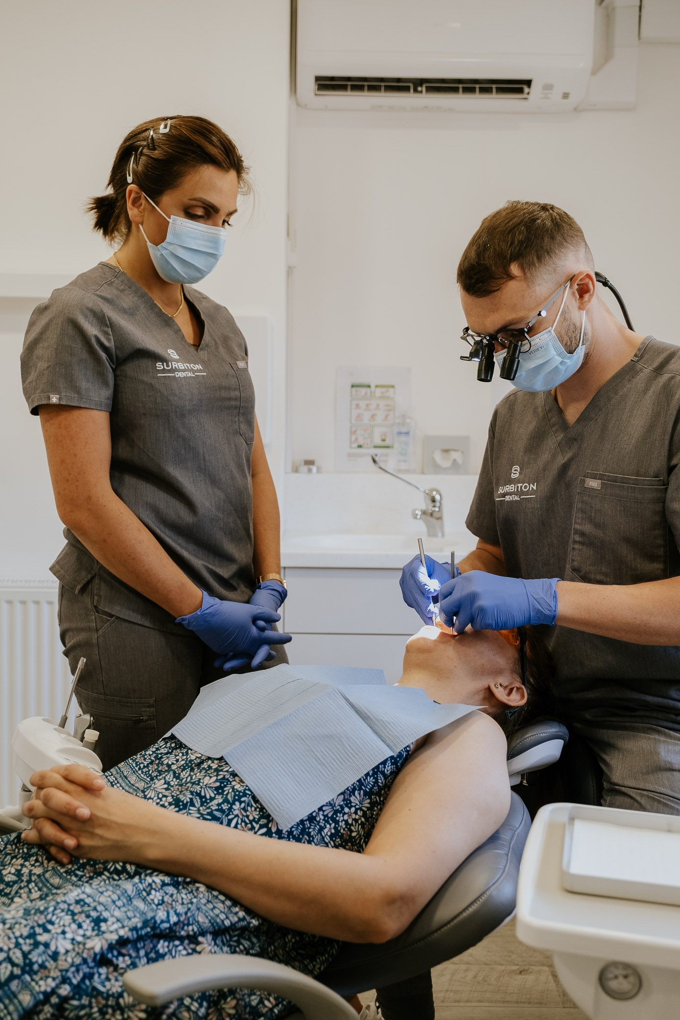 Dental team providing gentle treatment to a patient in the dental chair